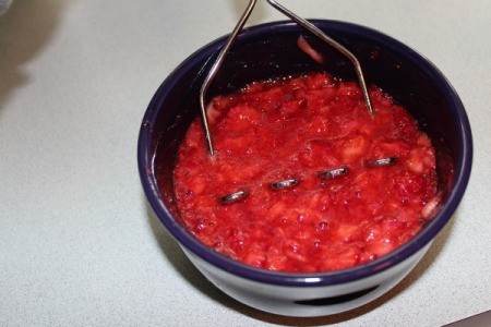 Mashed strawberries in bowl
