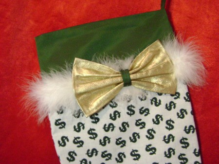 White fabric with green dollar sign print.
