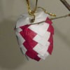 Finished red and white paper pinecone.