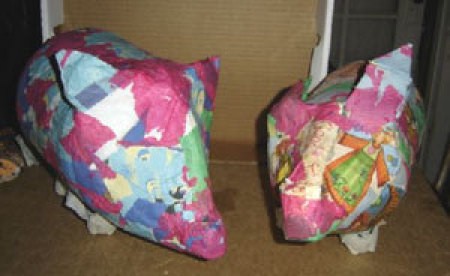 Decoupaged bleach bottles - two piggies.