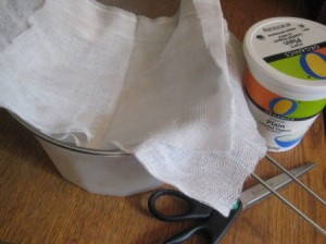 Straining yogurt through cheesecloth