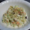 Photo of a small serving of coleslaw with the recipe included to the right of bowl.