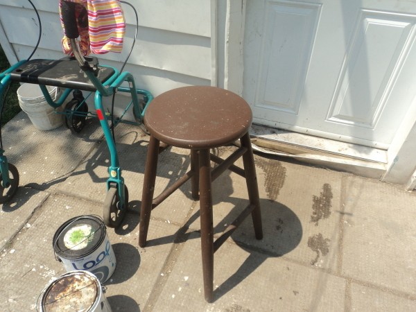 A brown wooden stool.