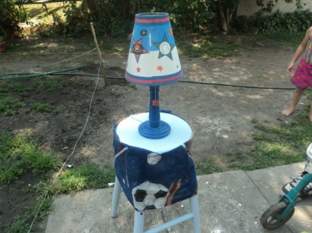 The finished nightstand from a wooden stool.