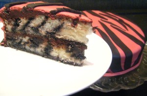 Finished cake with a slice on plate in foreground.