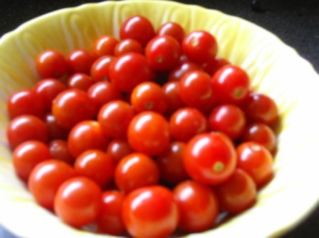 Bowl of ripe cherry tomatoes.