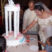 Photo of wedding couple and cake.