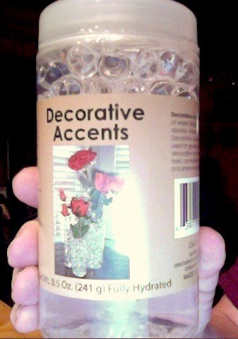 Bottle of Decorative Accents hydrated polymer beads.