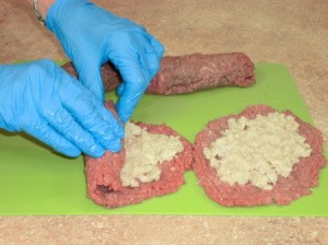 Rolling stuffing up inside steaks.