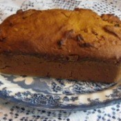 Pumpkin bread on blue and white plate.