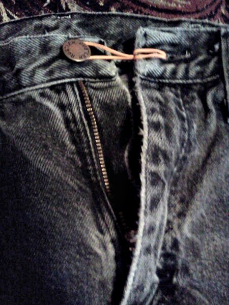 Rubber band on jeans button.
