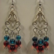 Dangle earrings with red and blue beads.