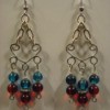 Dangle earrings with red and blue beads.