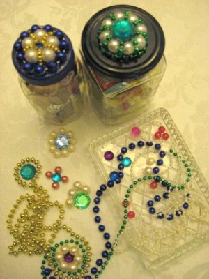 Two jars with finished lids, motifs, and beads.