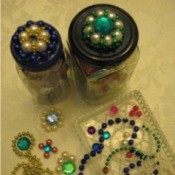 Two jars with finished lids, motifs, and beads.