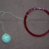 Ring for around the leg with ball attached for children's game.