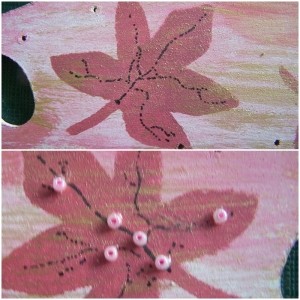 Adding veins and seed beads to leaves.