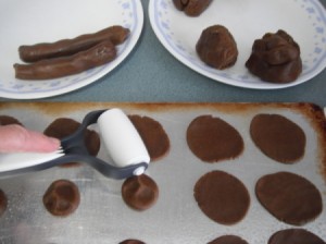 Rolling the cookies with the baker's roller.