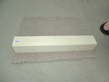 Attaching carpet to post.