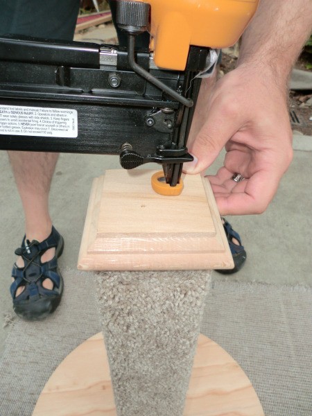 Nailing the top of the post.