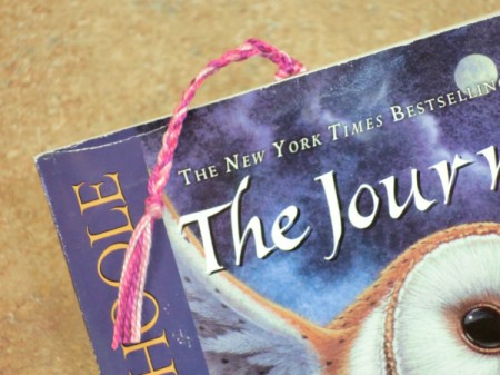 Clipped to the page of a book.