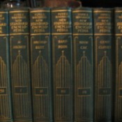Closeup of the spine of several volumes.