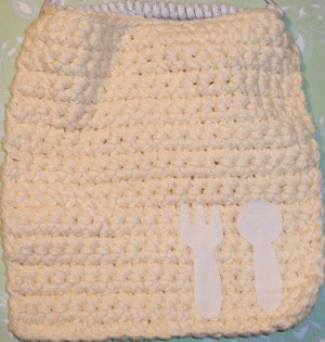 Pink washcloth bib.