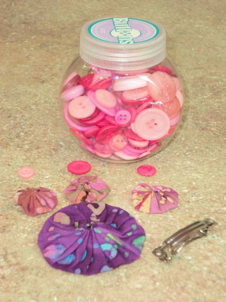 Supplies for pink and purple barrette.