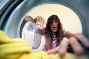 A woman looking at her stained clothing.