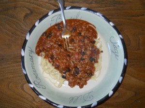 Chili over spaghetti.