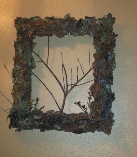 Bark covered picture frame with additional twigs added for interest.