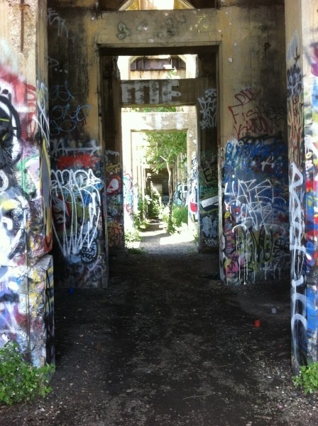 View of receding passageways with lots of graffiti.