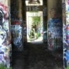 View of receding passageways with lots of graffiti.