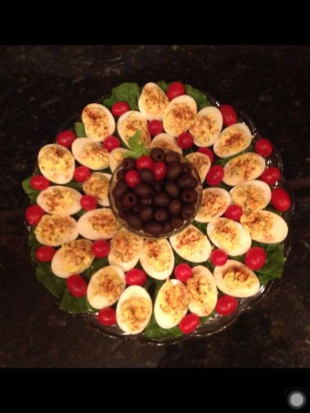 A nicely displayed plate of deviled eggs.