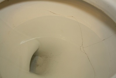 Old Cracked Toilet Bowl