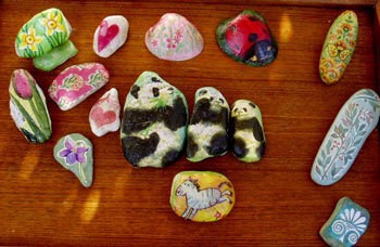 Variety of paper weights with animal motifs.