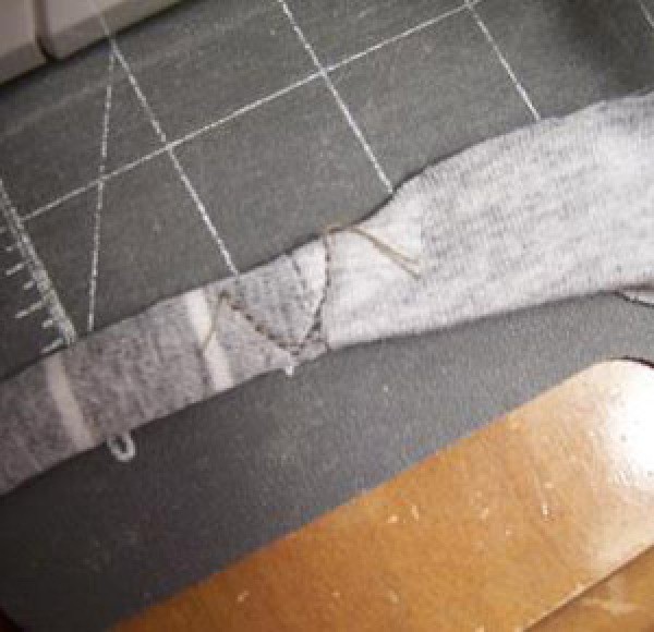 Sewing strips of material together.