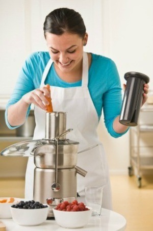 Woman Using a Juicer