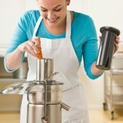 Woman Using a Juicer