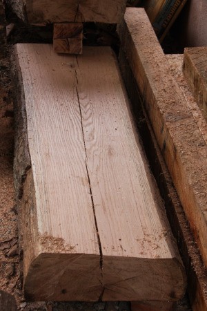 Oak plank with cracks.