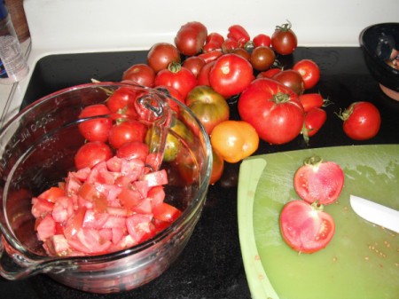 Garden tomatoes being chopped for soup