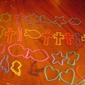 A collection of brightly colored cookie cutters.