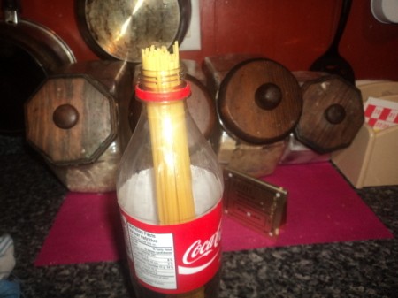 2-liter bottle holding pasta