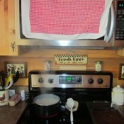Use a Towel to Catch Steam from Cooking