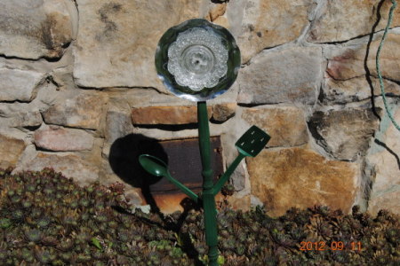 Recycled materials make a garden flower.