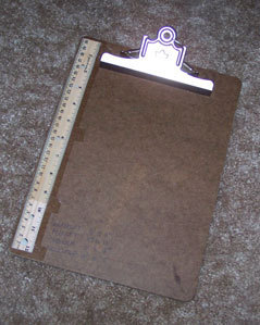 Ruler attached to clip board.