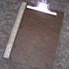 Ruler attached to clip board.