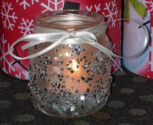 Decorated baby food jar votive candle holder.