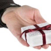 Hand Holding Small Christmas Gift