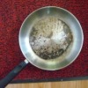 A badly burned stainless steel pan
